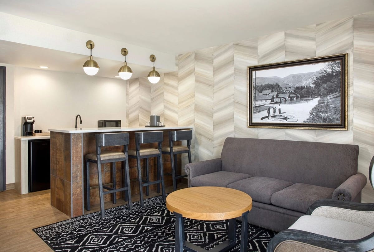 A warm, finished interior lounge with reclaimed timber wall detailing