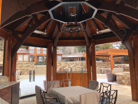 A heavy-timber gazebo with a vaulted ceiling overlooking the valley