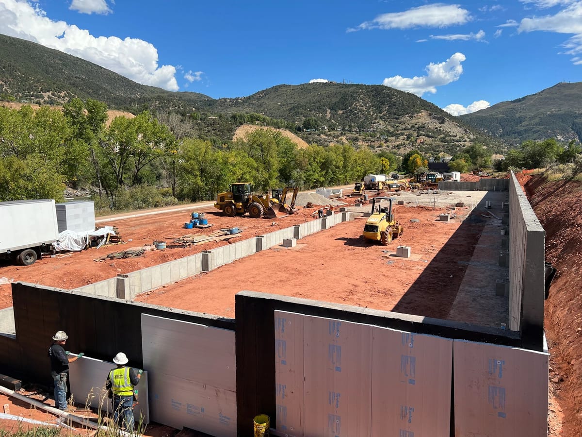 Foundation walls and site work underway on a large Glenwood Springs project