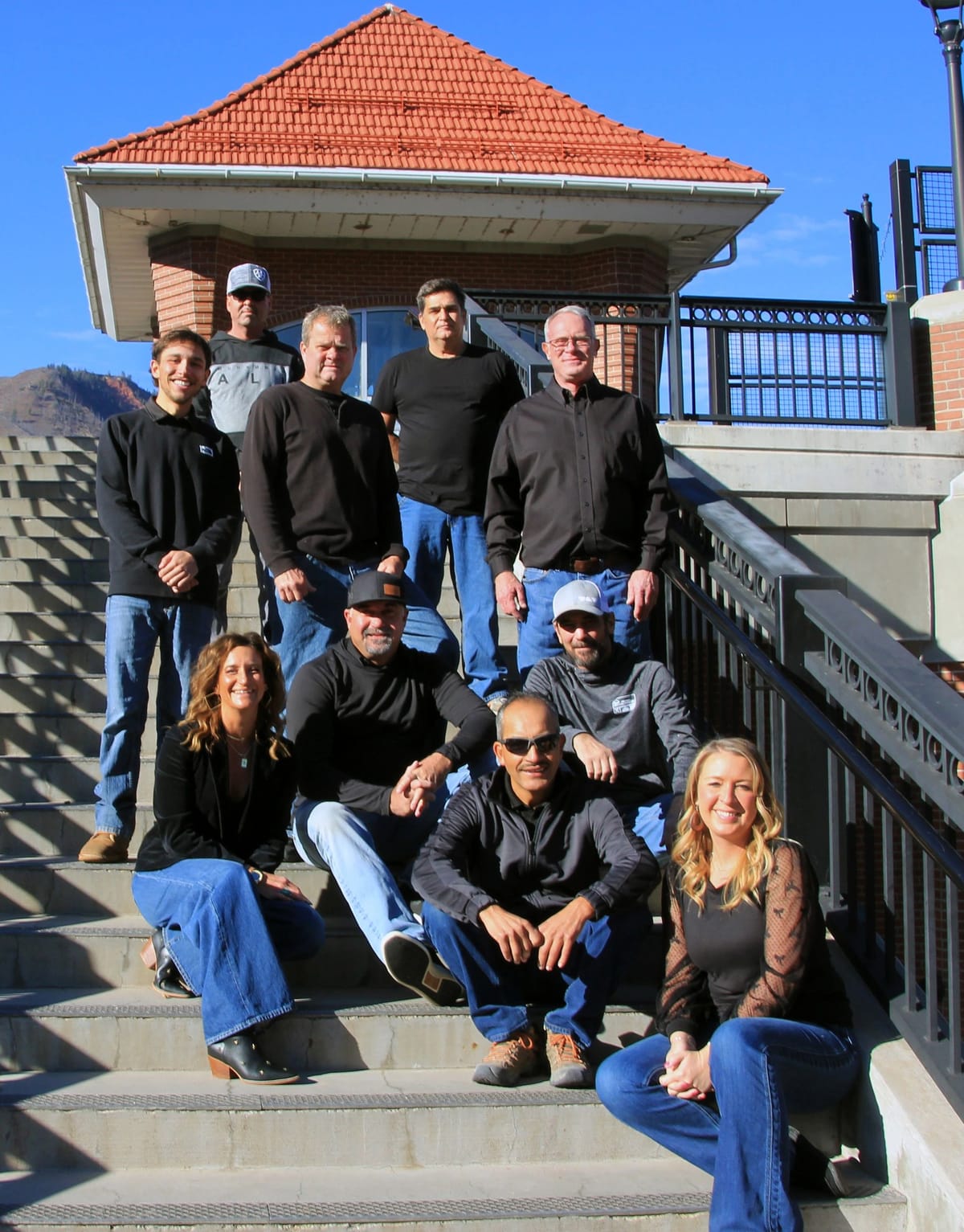 The D.M. Neuman crew gathered on a completed project's stairway