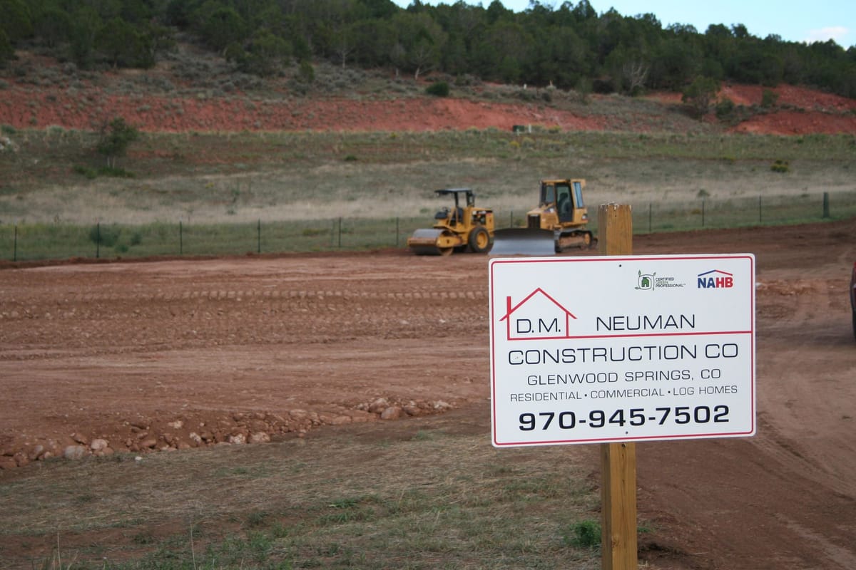 Excavation and site work at Springridge with the valley beyond